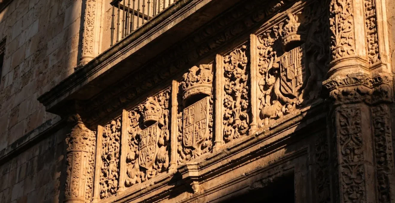 Early morning sun creating dramatic shadows on ornate stone relief carvings