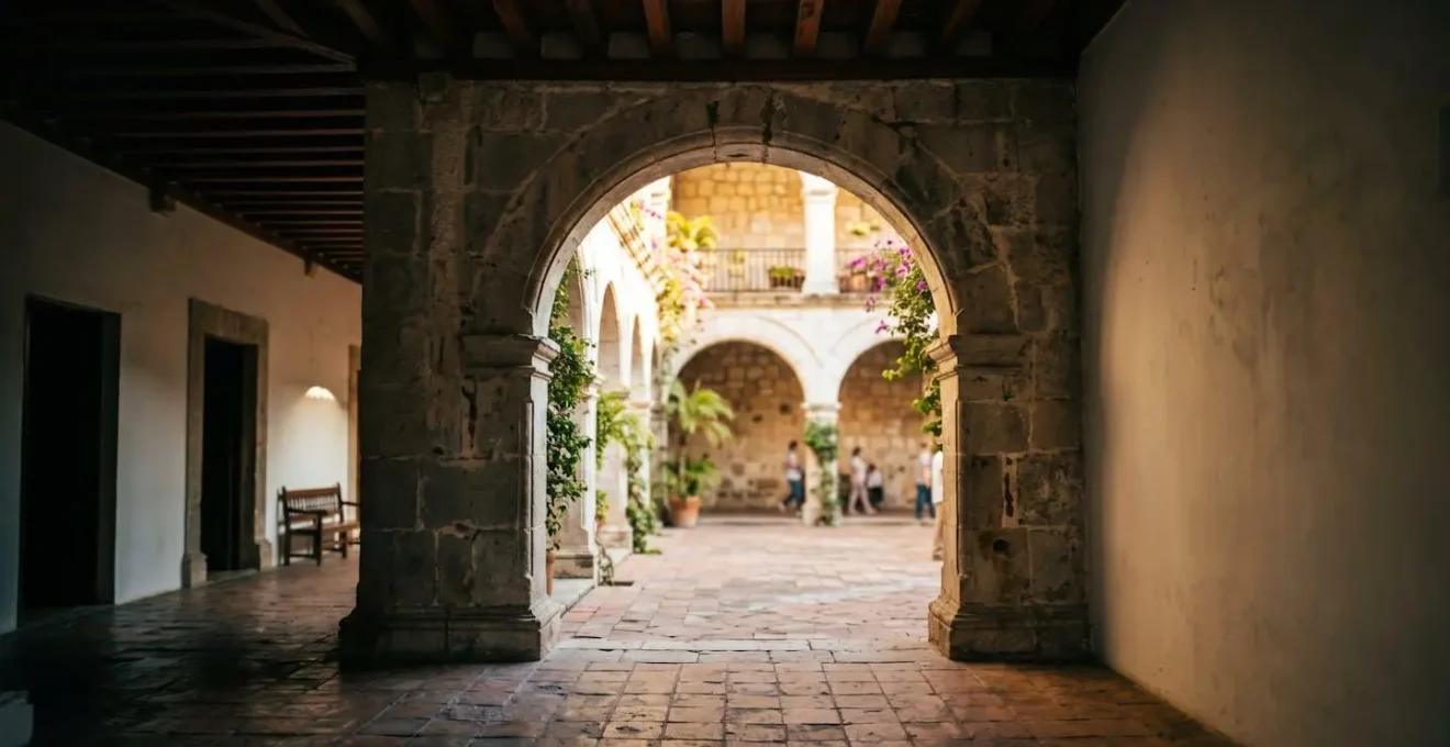 Stone archway and corridor of a converted convent showing the communal courtyard design in Santo Domingo's Zona Colonial