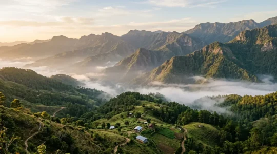 Panoramic view of lush green mountain valleys in the Central Cordillera with morning mist