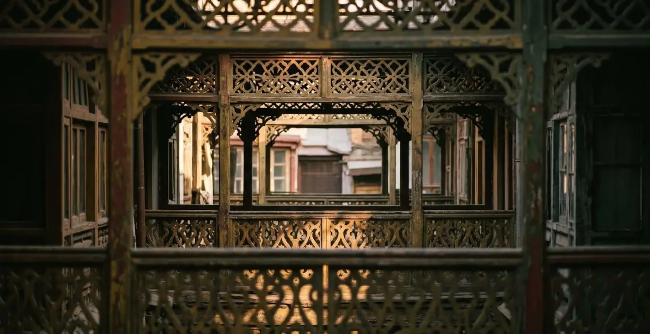Repeating wooden fretwork patterns on Victorian balconies compressed through telephoto lens perspective