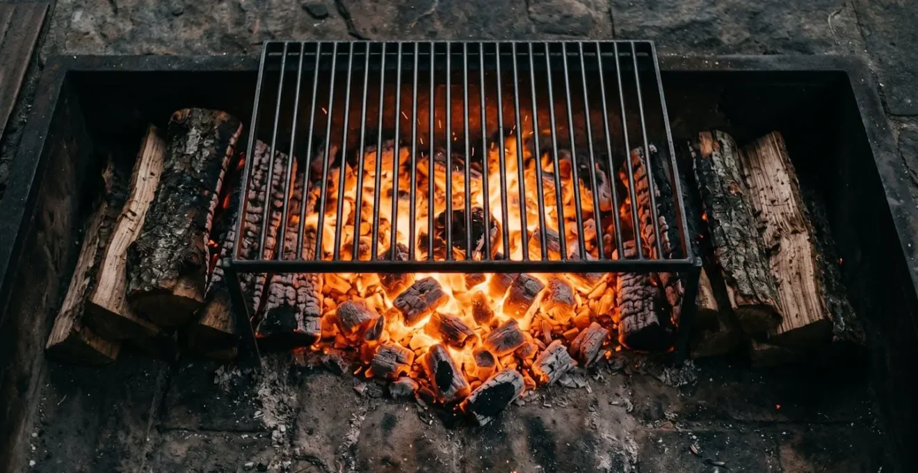 Glowing wood fire embers and controlled coals ready for cooking